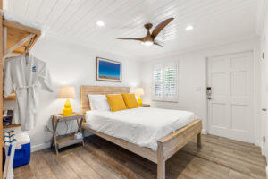 white shiplap ceiling, bed