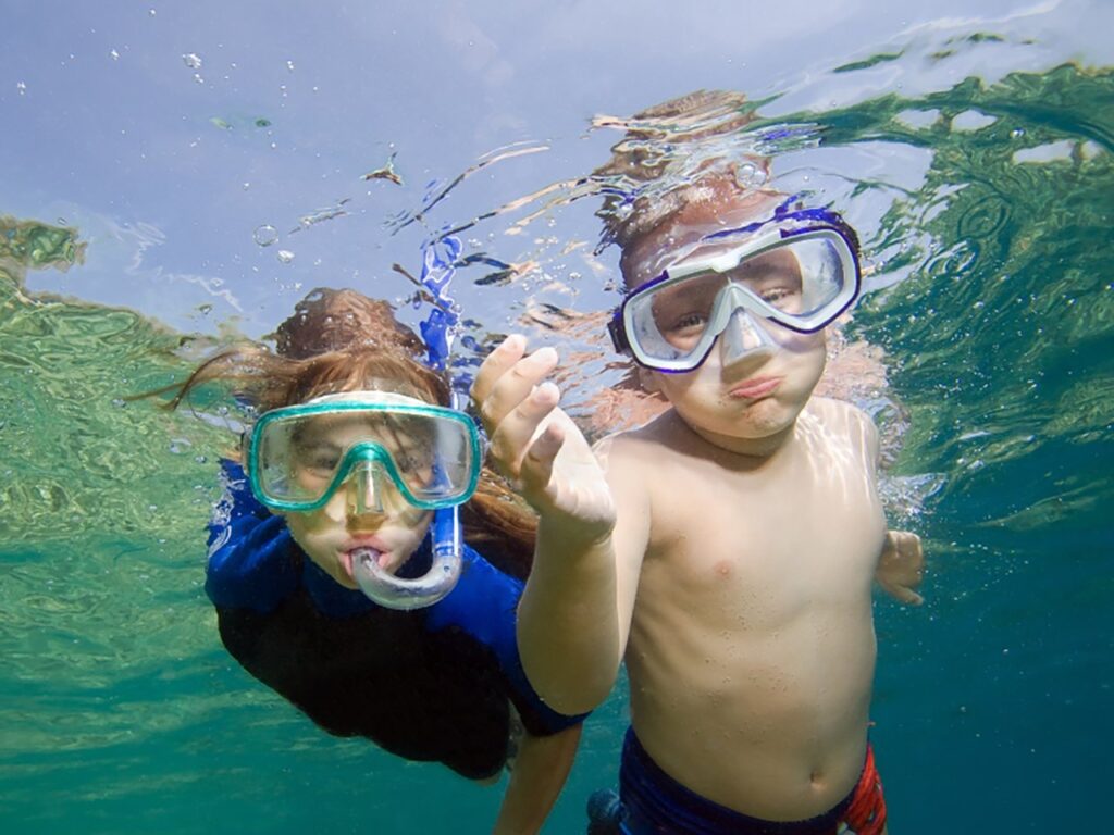 two kids snorkeling