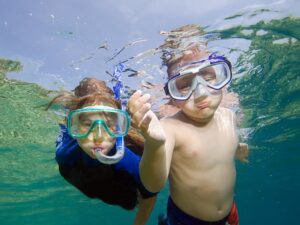 two kids snorkeling