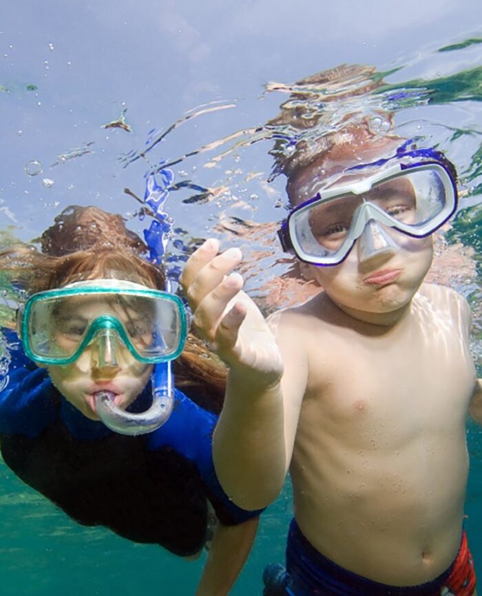 two kids snorkeling