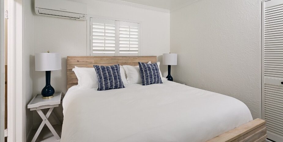 Corraline bedroom in white with navy accents