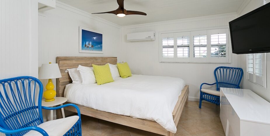 white beadboard, bed, dresser, blue chairs
