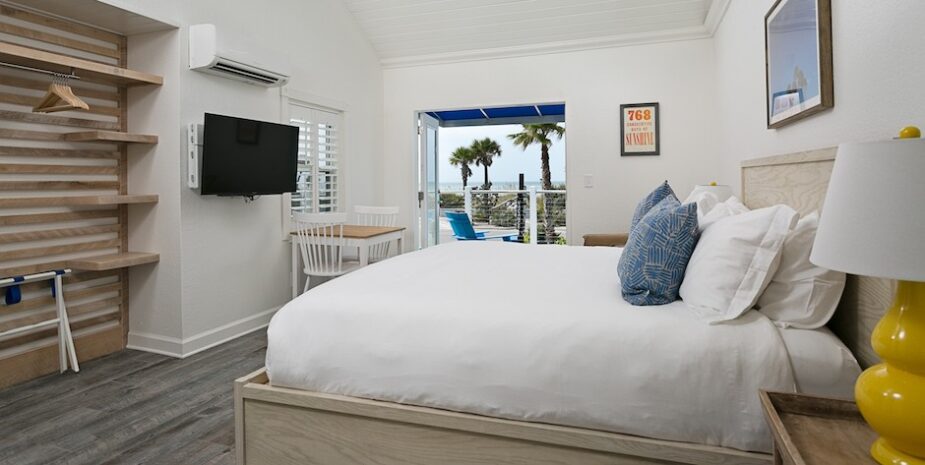 Room with flatscreen TV and view of beach